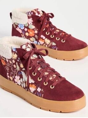 Keds burgundy, suede high top  sneakers with floral and fleece accents.